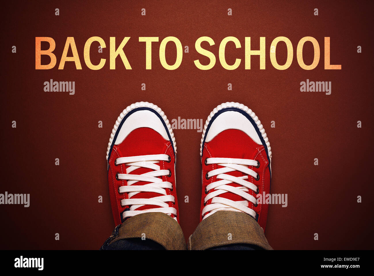 Teenager Pupil Standing in Front of back to School Title Line, Top View Image for New School year. Stock Photo