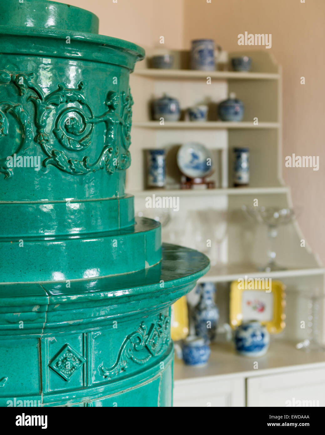 Detail of turquoise ceramic antique stove Stock Photo