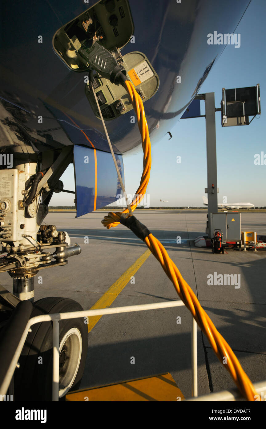 Detail of aircraft on blocks, airport ground, external power support