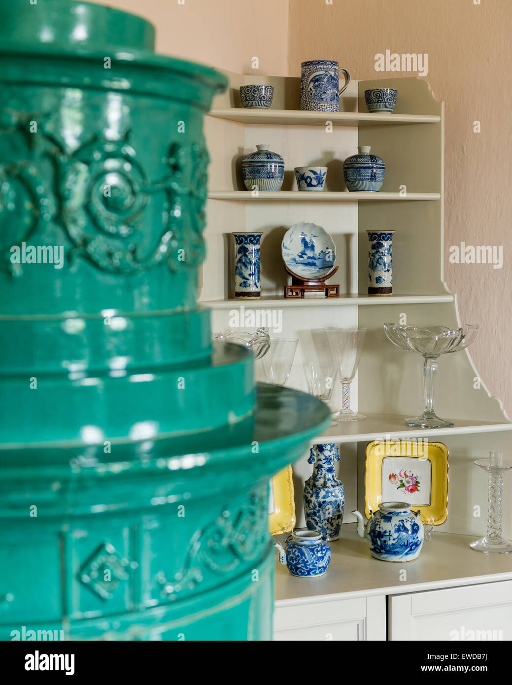 Detail of turquoise ceramic antique stove Stock Photo