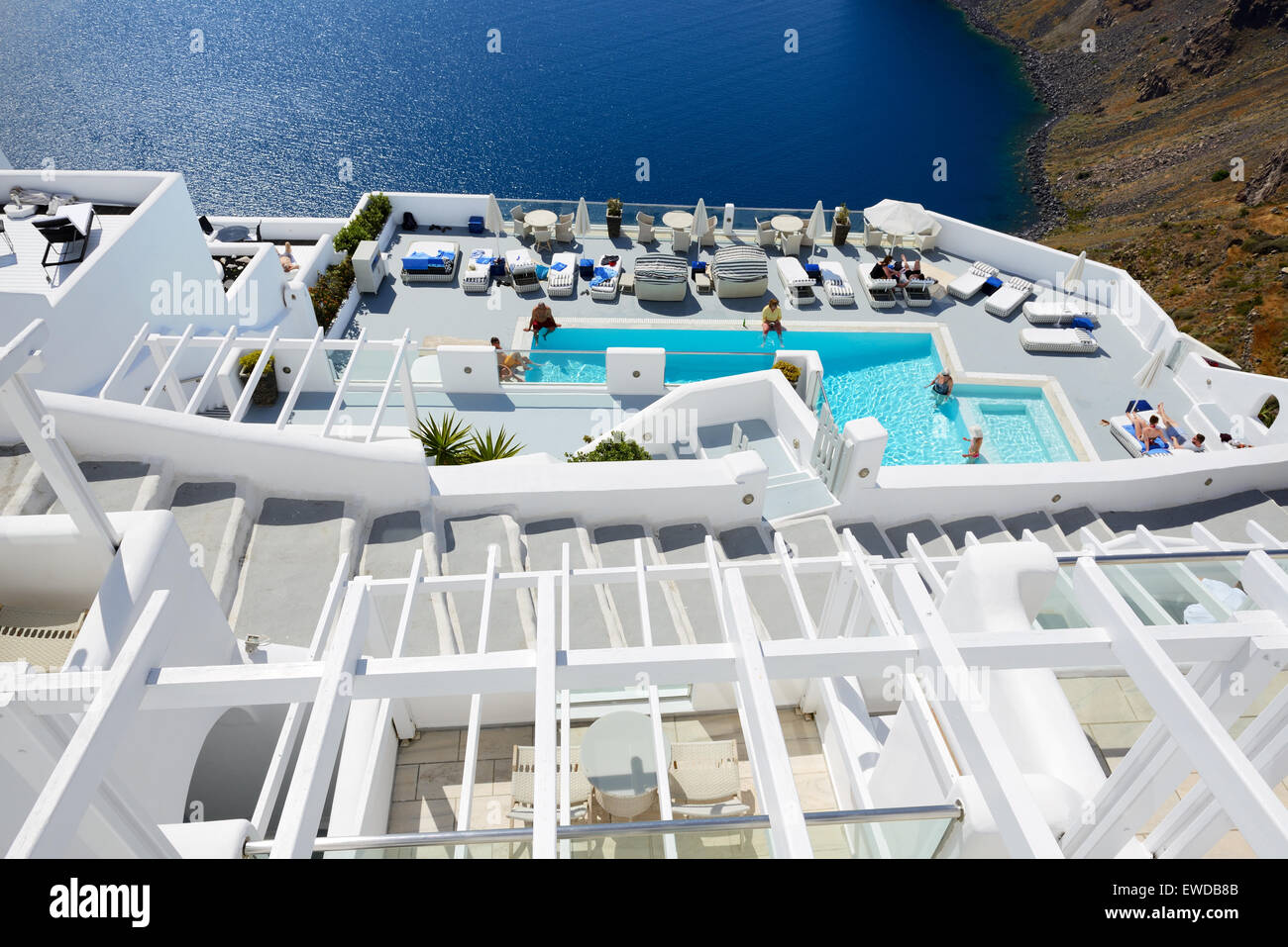 The tourists enjoying their vacation at luxury hotel, Oia, Greece Stock Photo