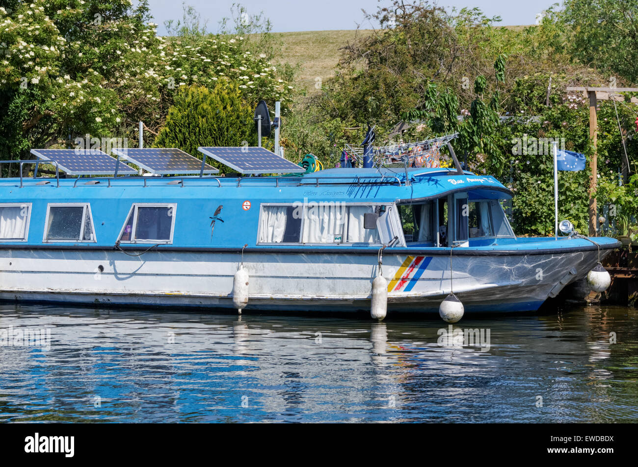 Boat with solar panels on River Lea, London England United Kingdom UK Stock Photo