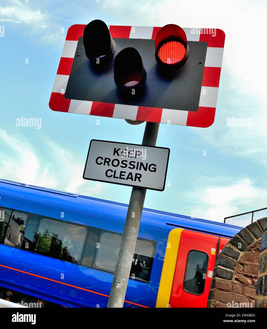 Close up of railway level crossing warning sign Chiswick London UK Stock Photo