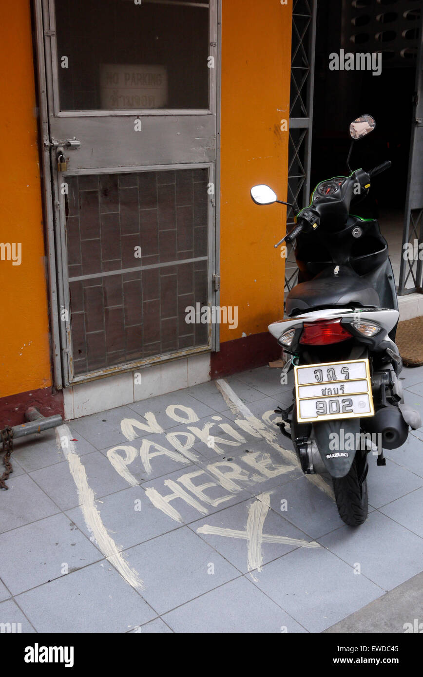 Parked Motorcycle Avoiding No Parking Zone In Front Of Door