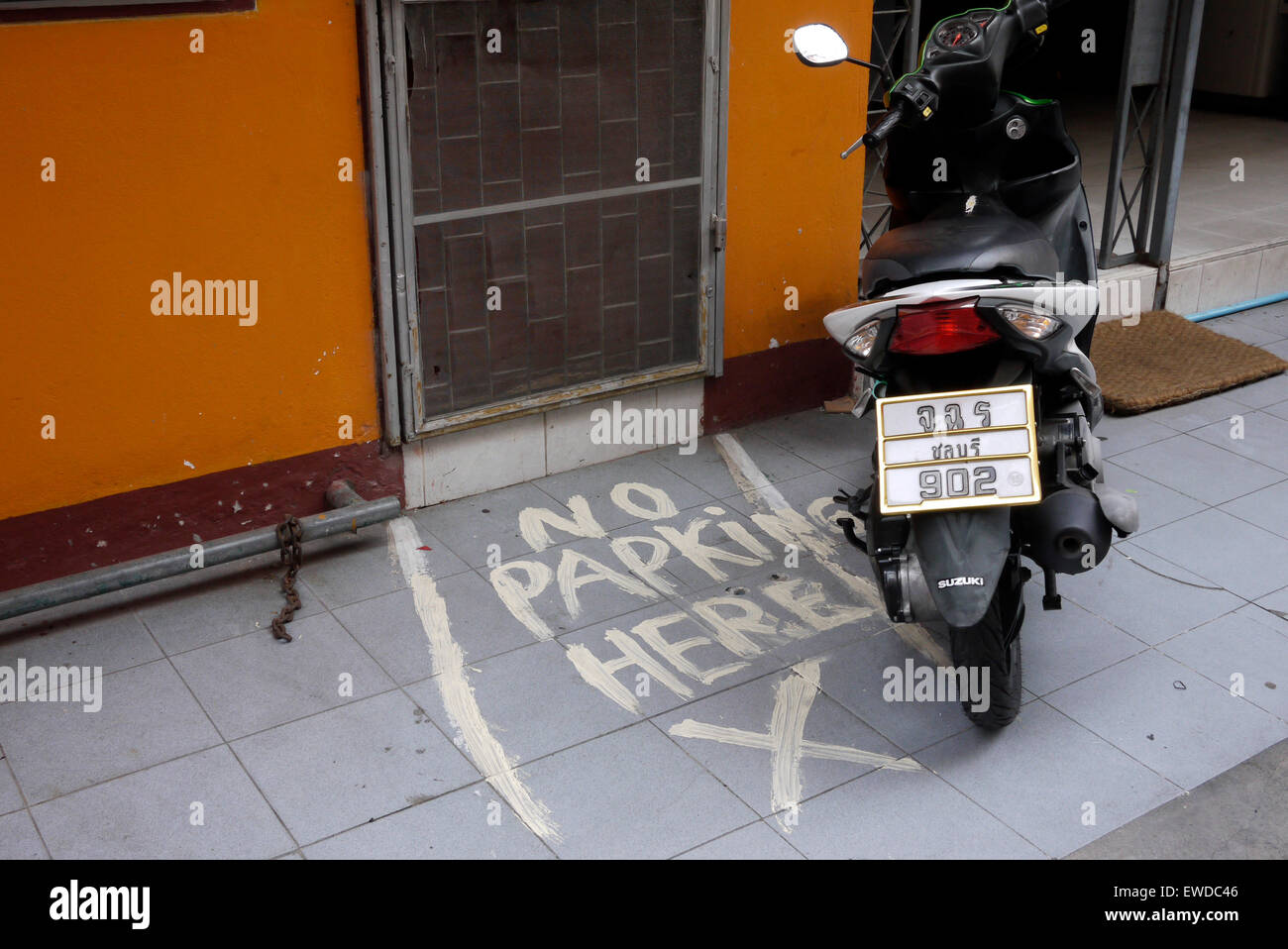 Parked Motorcycle Avoiding No Parking Zone In Front Of Door