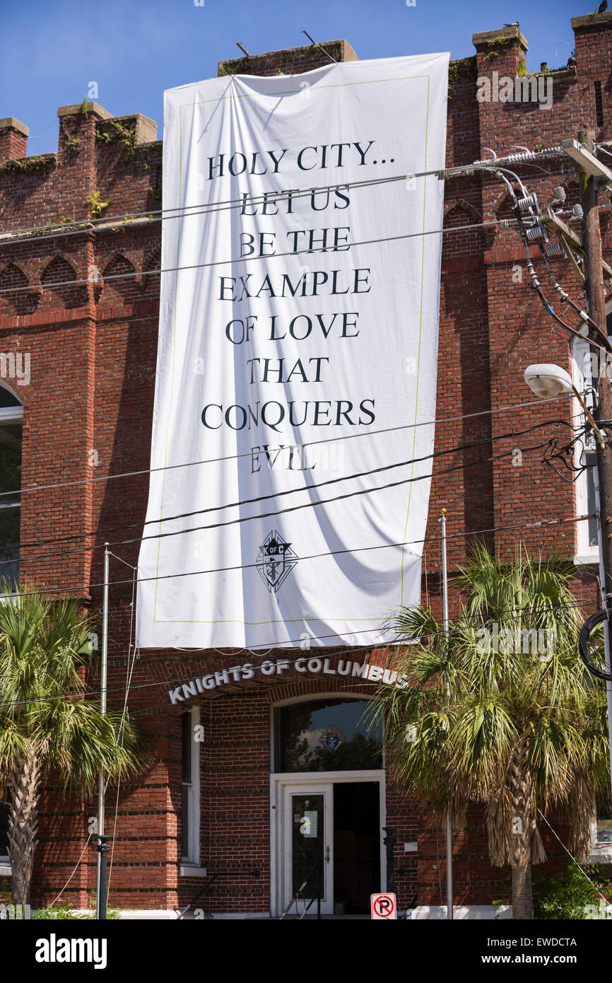 Charleston, South Carolina, USA. 23rd June, 2015. A sign in support of the nine members of the historic mother Emanuel African Methodist Episcopal Church that were gunned down is hung from a building June 23, 2015 in Charleston, South Carolina. Stock Photo