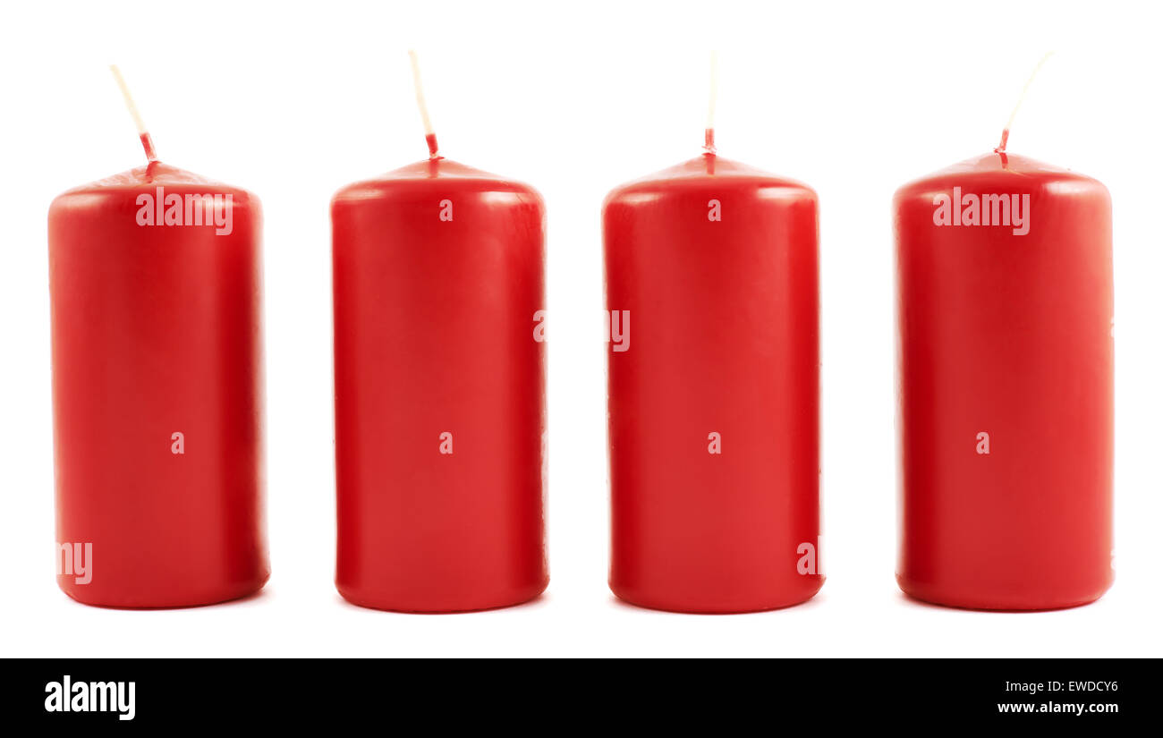 Four red wax candles isolated Stock Photo Alamy