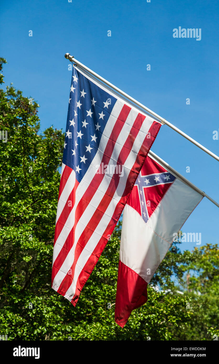 American flag with a flag of the confederate states on green and blue background Stock Photo