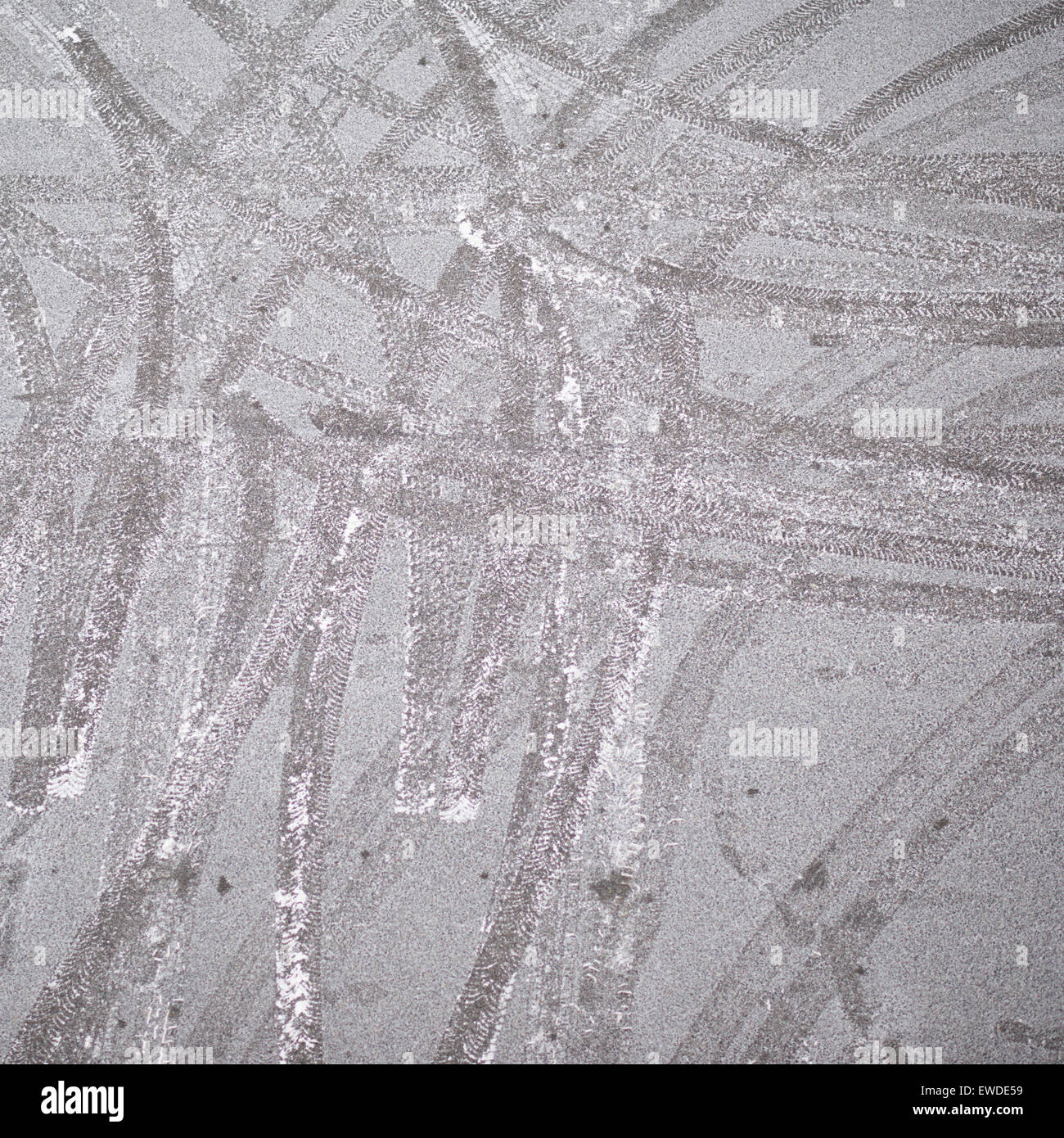 Image showcasing Frosted asphalt covered with the tire tracks Stock Photo - Alamy