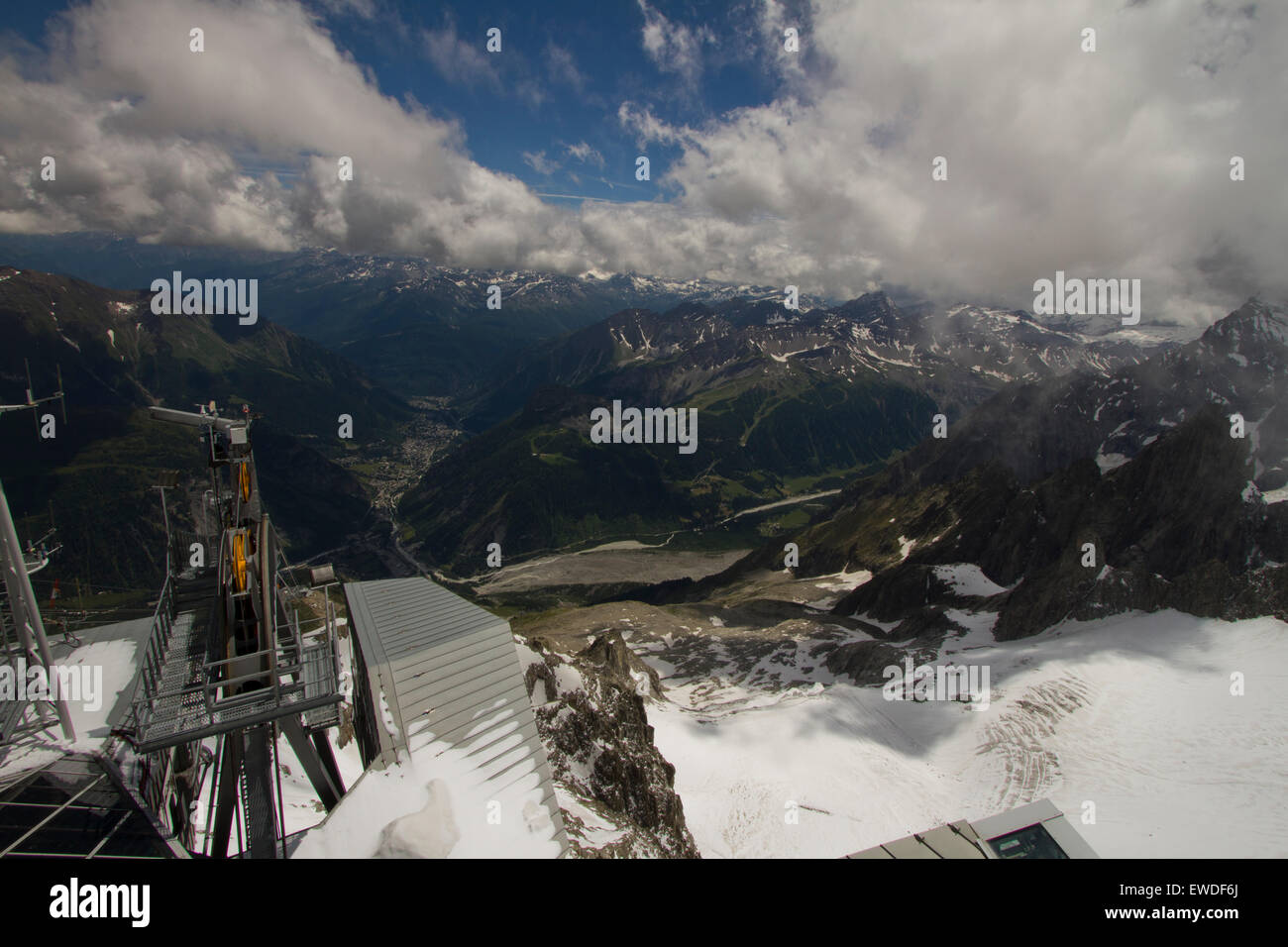 Courmayeur, Italy. 23rd June, 2015. Panoramic view of Courmayeur and Aosta Valley from the arrival station of Skyway cable car. The cableway connects the city of Courmayeur to Pointe Helbronner (3,466 m) in the Mont Blanc massif. © Marco Destefanis/Pacific Press/Alamy Live News Stock Photo