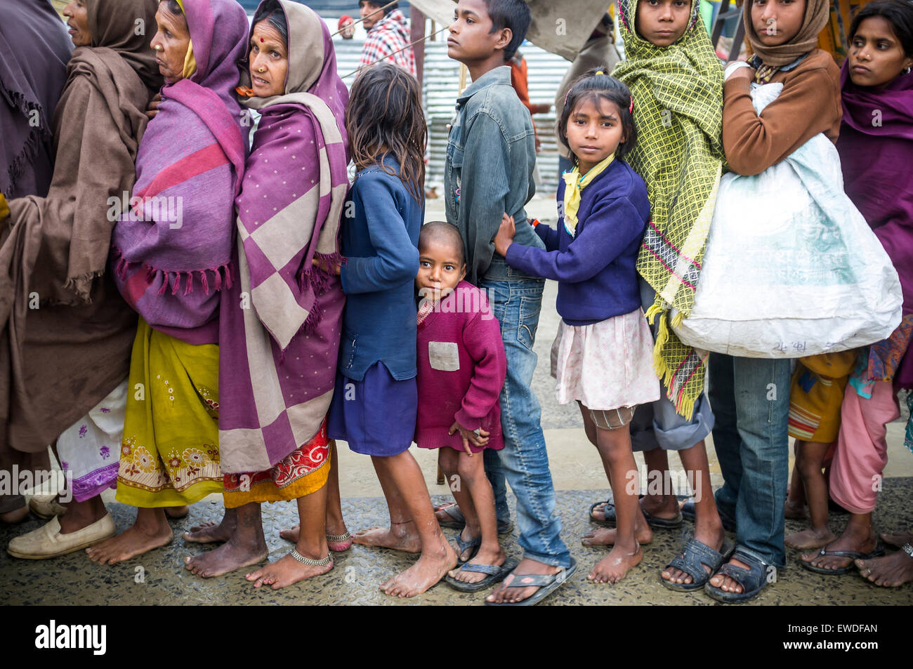 A group of pilgrims standing in line for a free meal during Kumbh Mela, Allahabad, Uttar Pradesh, India. Stock Photo