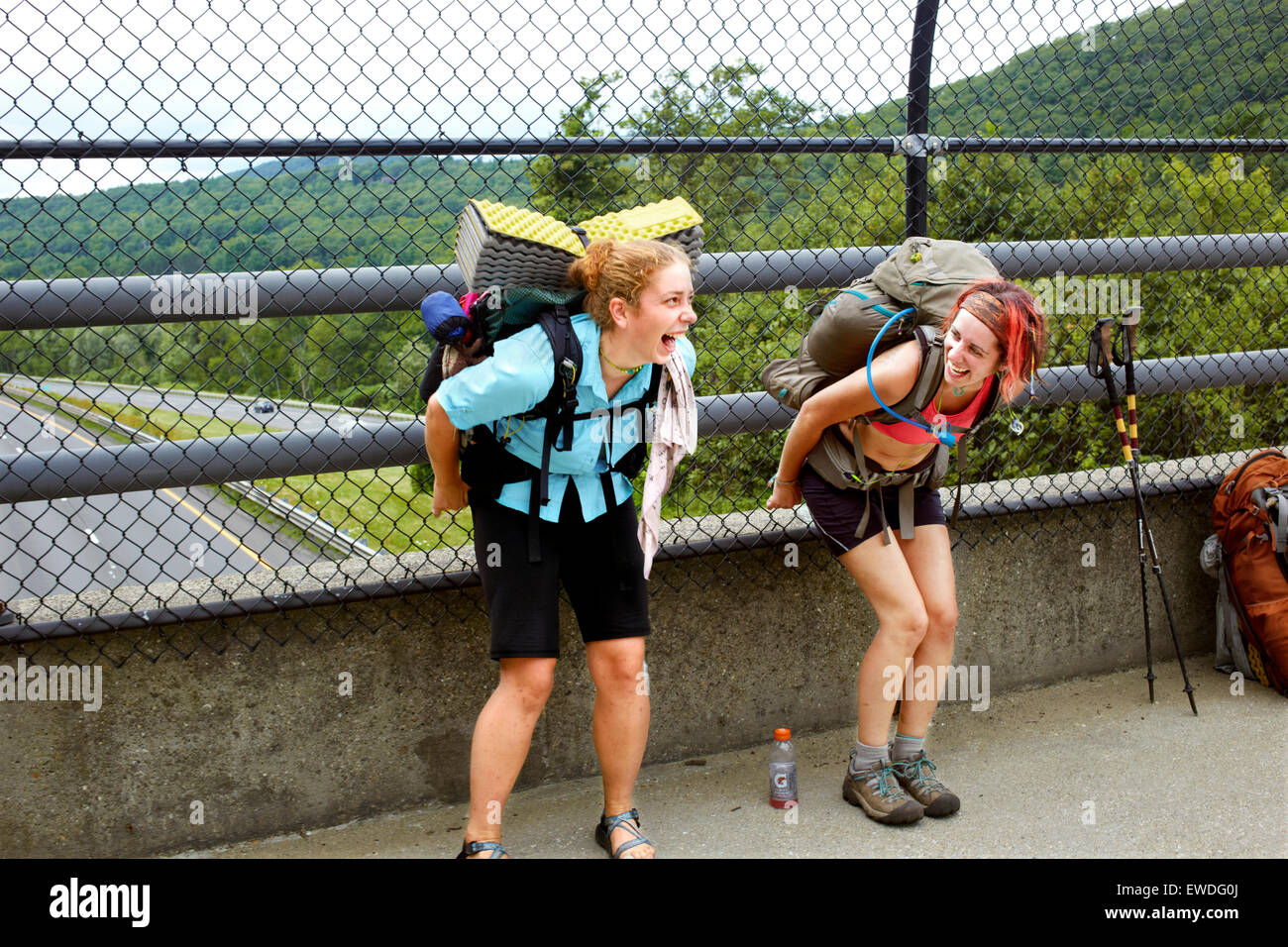 Two hikers mooning traffic on I 90. Stock Photo