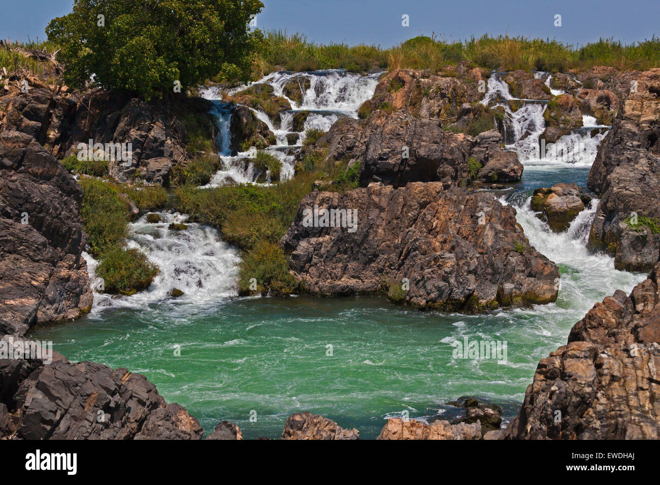 The TAM I DAENG WATERFALL is off the beaten track on the MEKONG RIVER in the 4 Thousand Islands Area (Si Phan Don) near DONE KHO Stock Photo