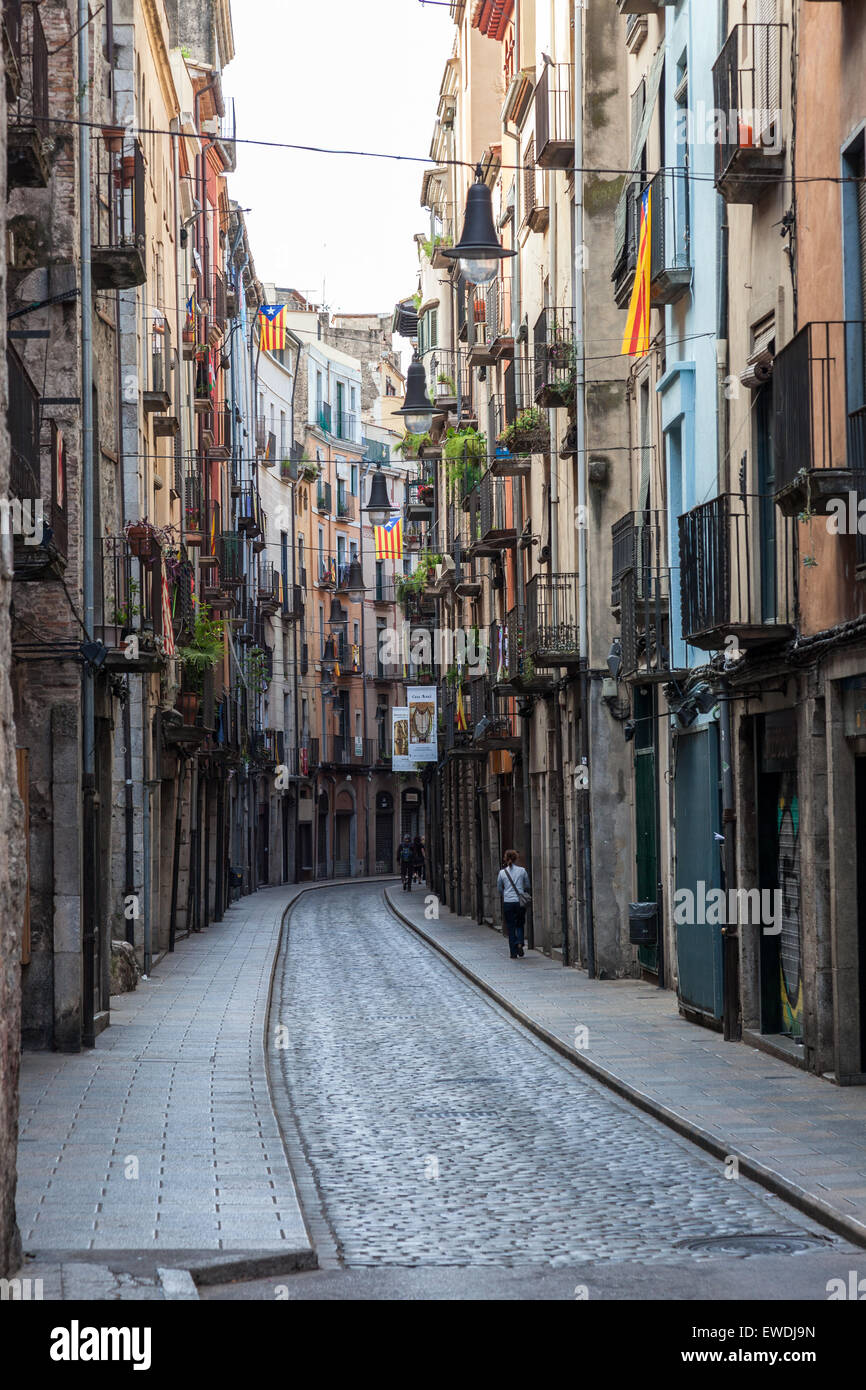 Narrow street in the old town of Girona, province of Catalonia, Spain Stock Photo