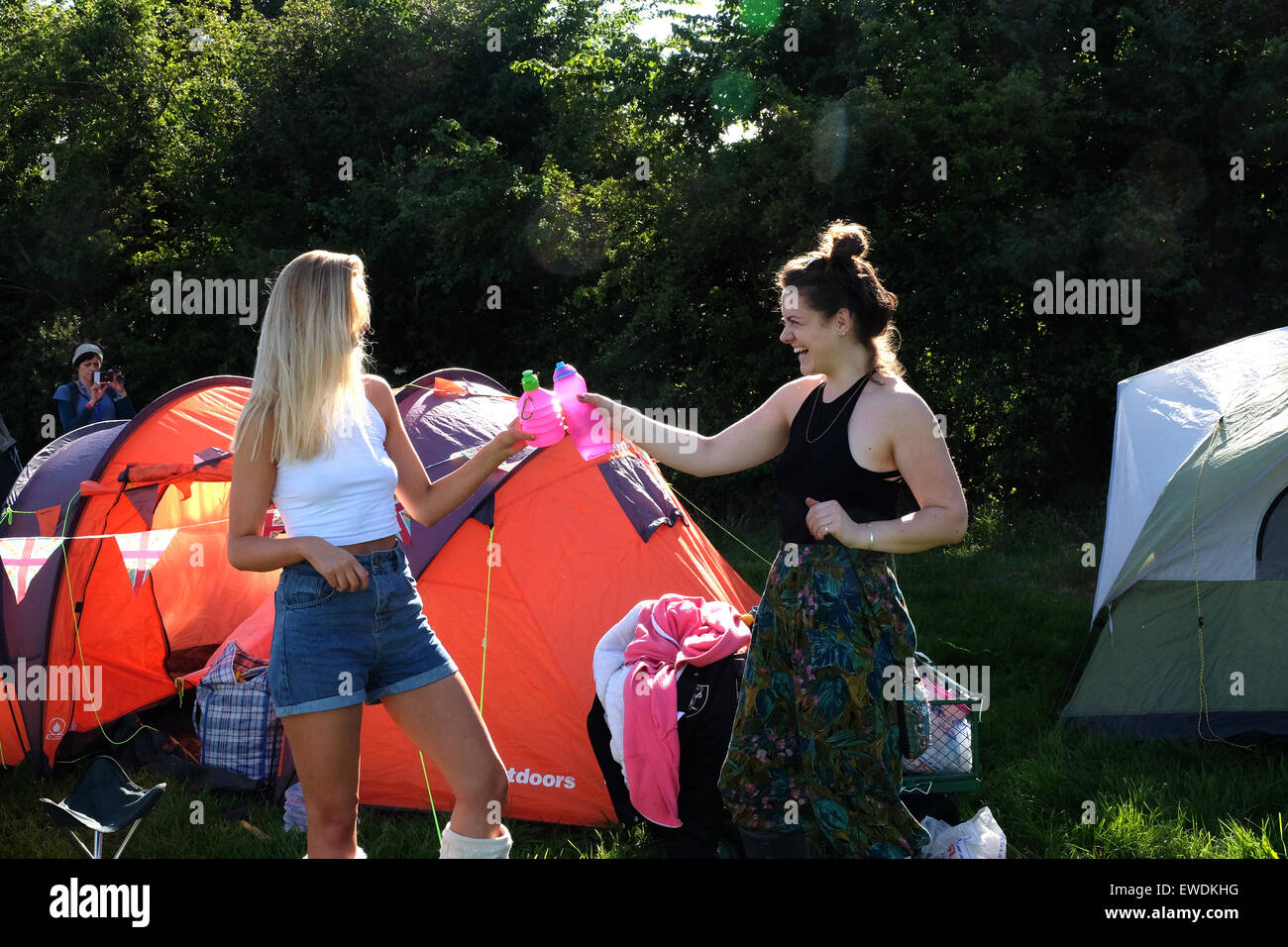 Glastonbury Festival, Somerset, UK. 24 June 2015. As the gates open for the 2015 Glastonbury Festival crowds swarm into the site carrying camping equipment and supplies to set up camp for the duration. Credit:  Tom Corban/Alamy Live News Stock Photo