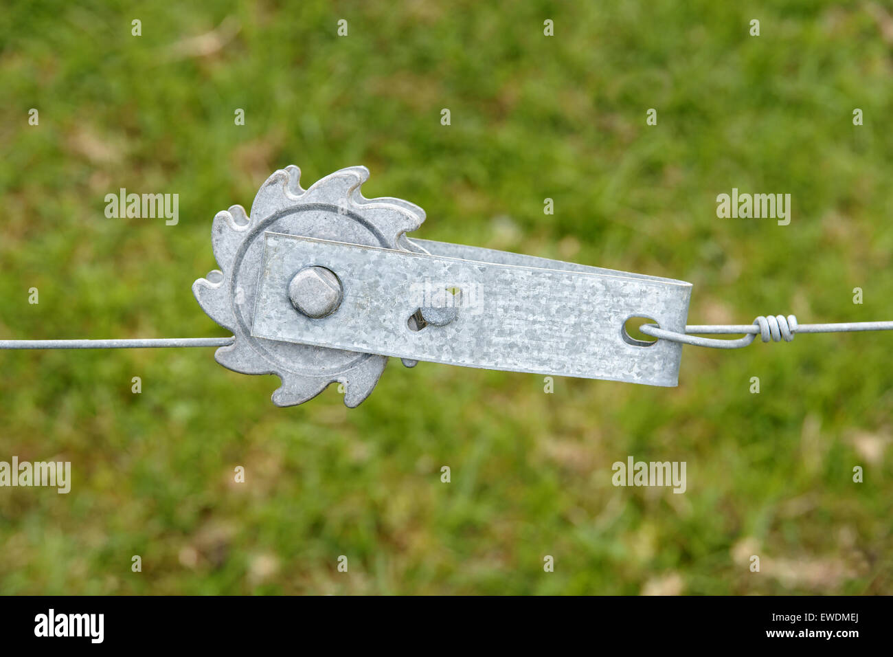 Ratchet fence tensioner for tightening wire stock fences on farms Stock Photo