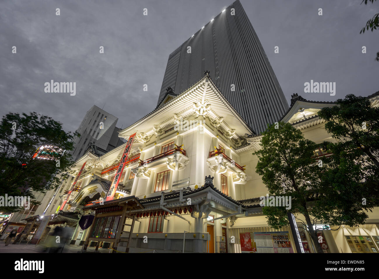 Kabukiza theatre in Ginza with skyscrapper at night. Tokyo Stock Photo