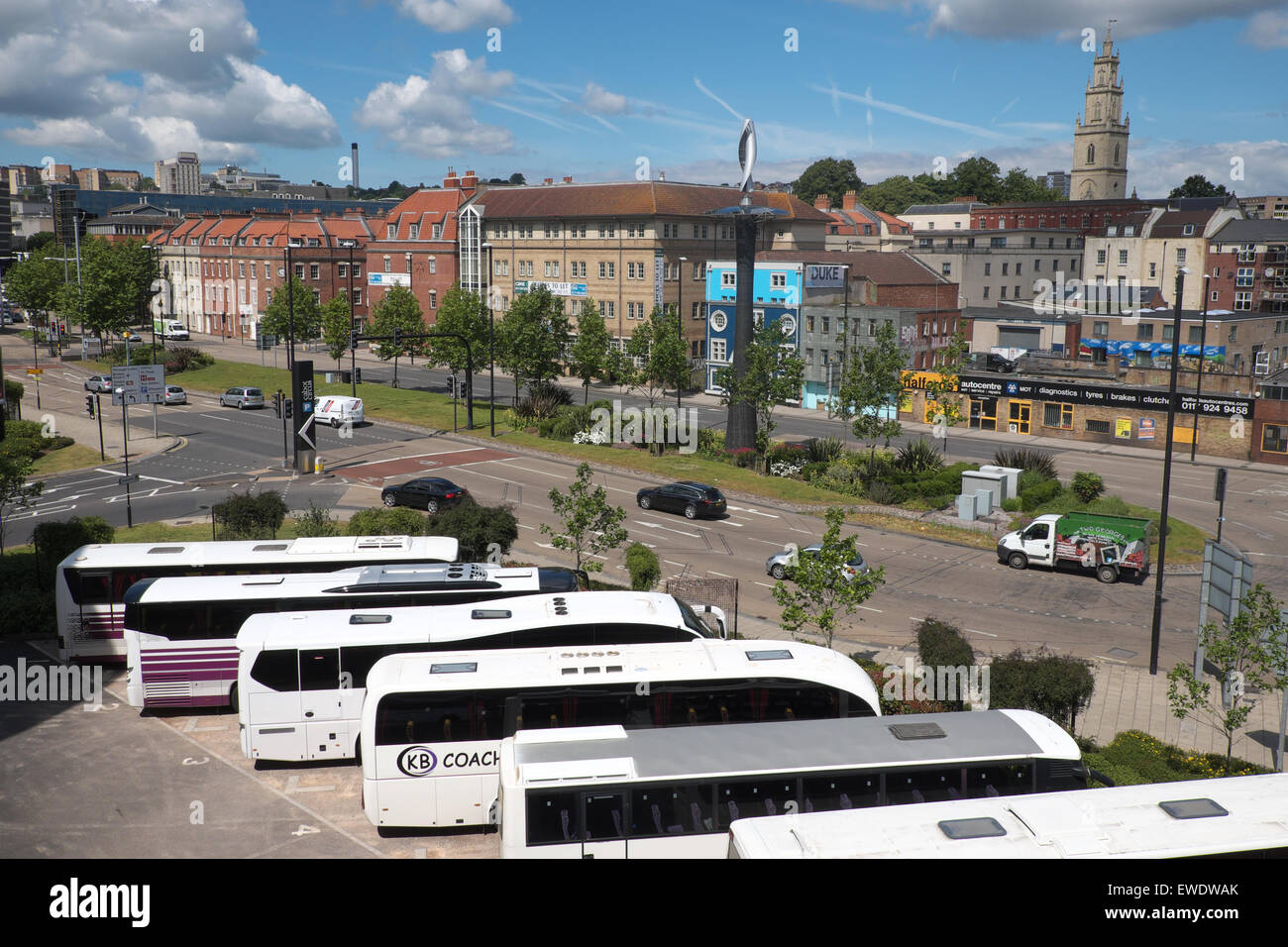 Bristol UK coaches parked at the Cabot Circus coach park beside Newfoundland Way in Bristol city centre with St Paul's church Stock Photo