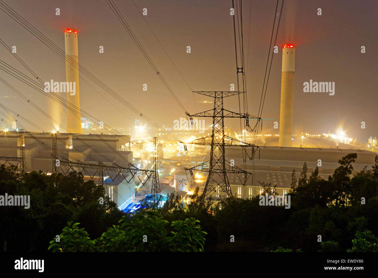 Power station with smoke at night Stock Photo