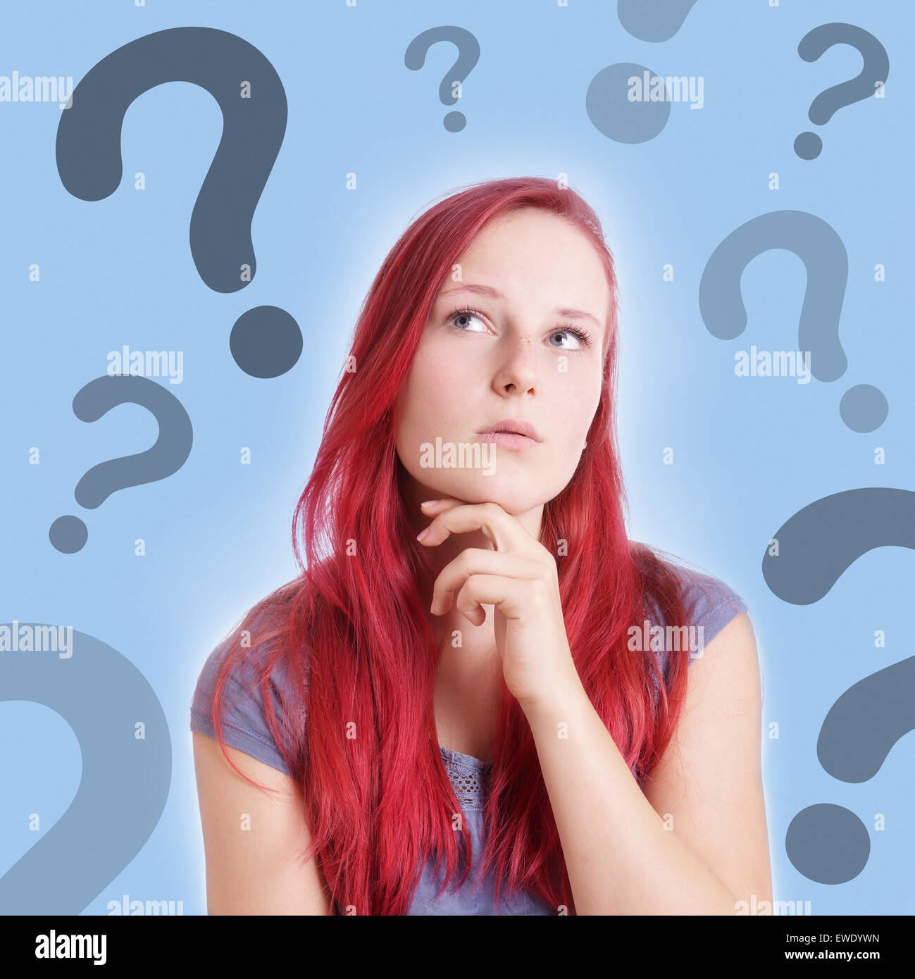 pensive young woman with interrogation marks Stock Photo