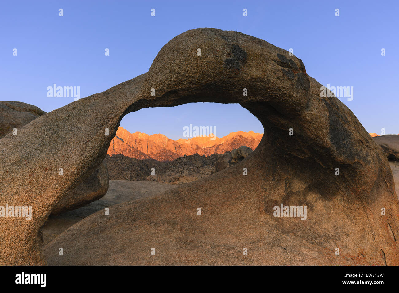 Sunrise at Mobius Arch in the Alabama Hills with the view towards the Sierra Nevada, California, USA. Stock Photo