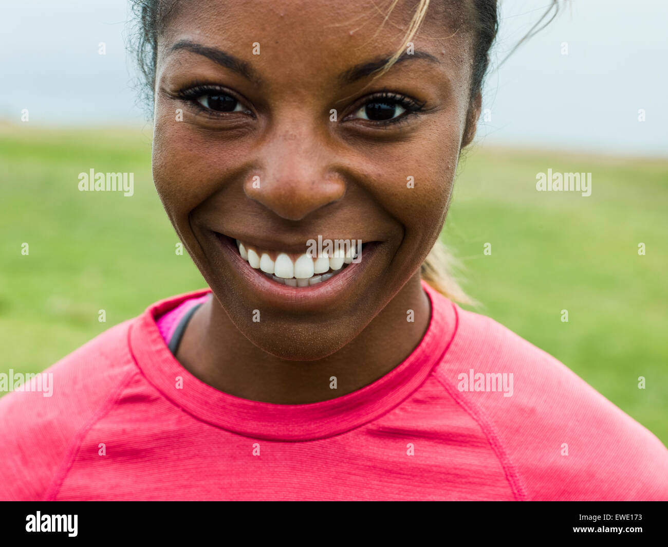 Portrait of a smiling young woman jogger Stock Photo