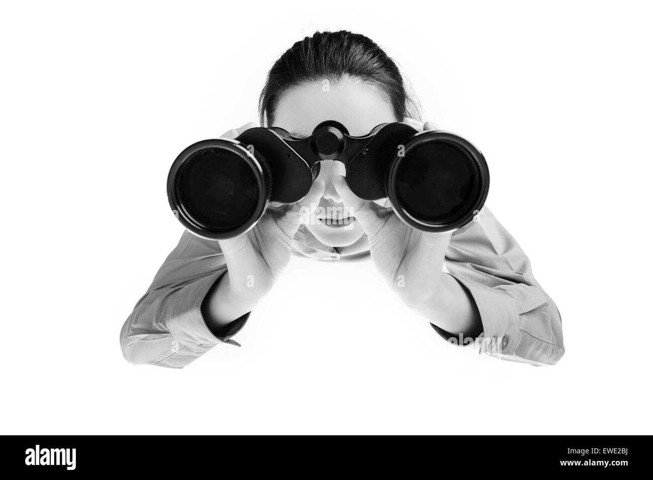woman looking through binoculars shot from a birds eye view looking down Stock Photo