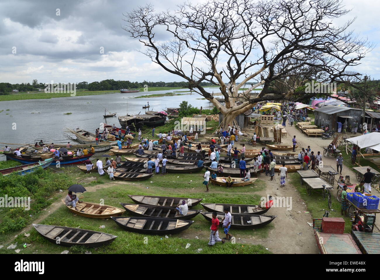 Boat makers display the wooden boat for sale at Kaikkarateke market , Narayanganj district in Bangladesh. On June 21, 2015 Stock Photo