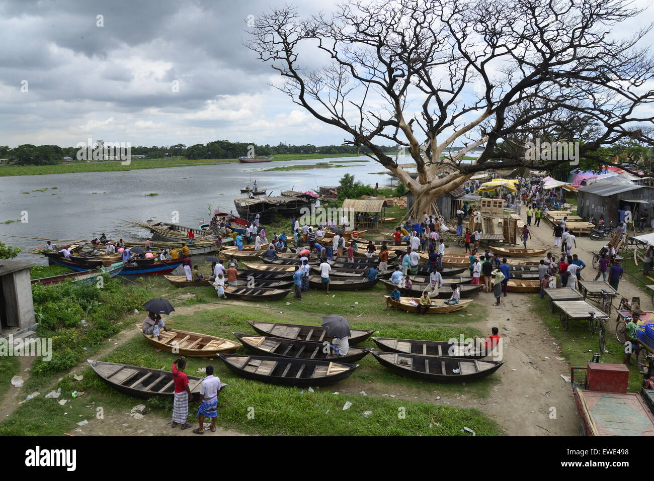 Boat makers display the wooden boat for sale at Kaikkarateke market , Narayanganj district in Bangladesh. On June 21, 2015 Stock Photo