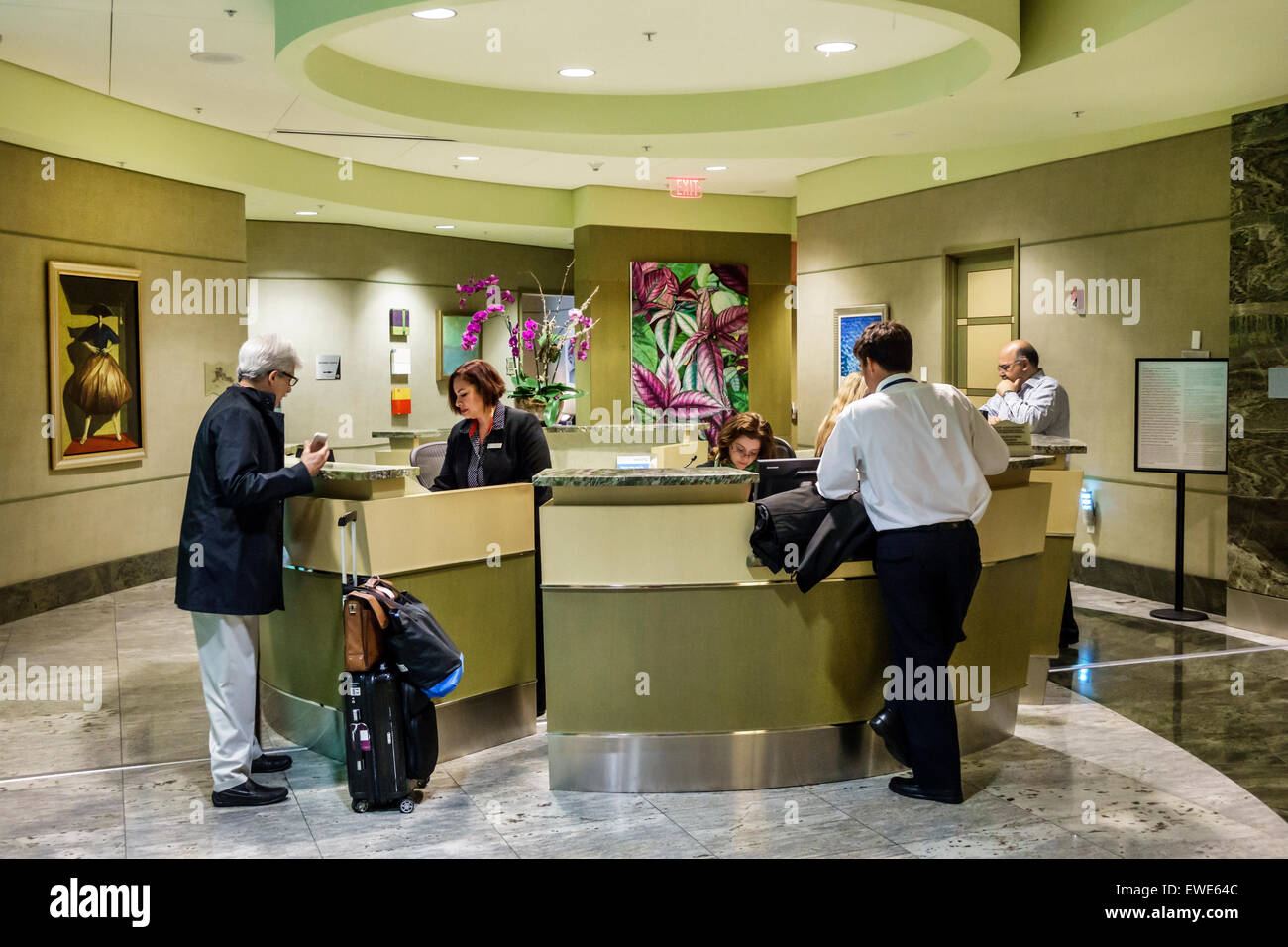 Miami Florida,International Airport,MIA,interior inside,terminal,gate,American Airlines Admirals Club,lounge,front desk check in reception reservation Stock Photo