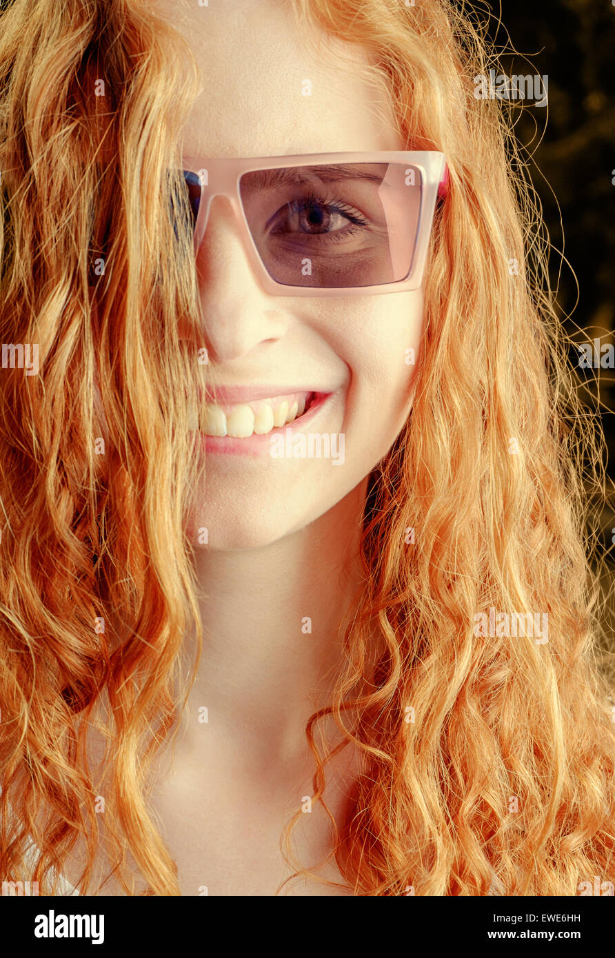 Summer portrait beautiful redhead young woman wearing sunglasses. Summertime happyness Stock Photo