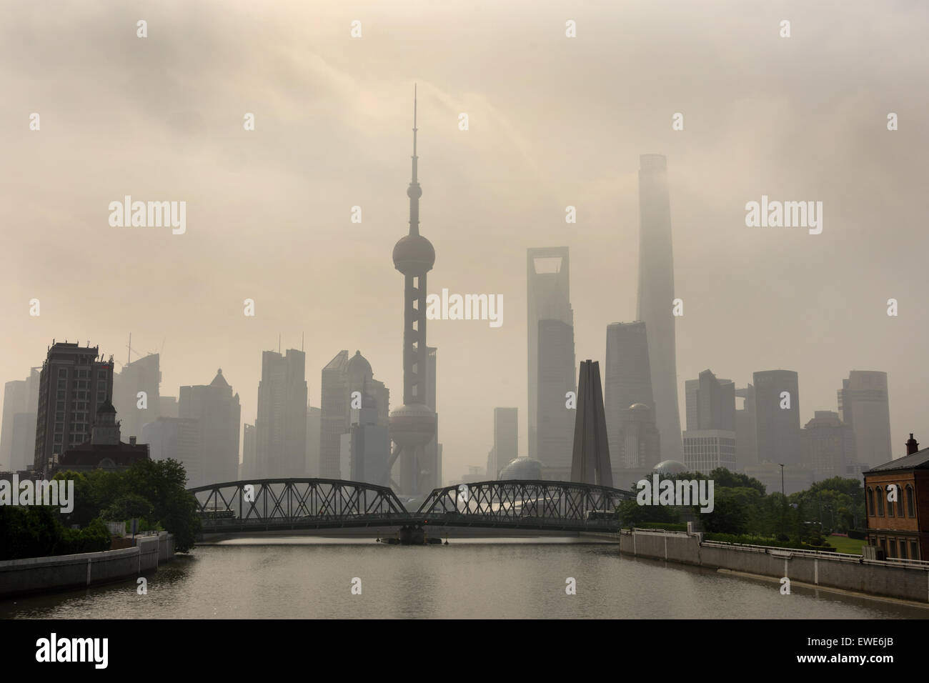 Shanghai Waibaidu Bridge with Pudong City on background  Skyline Oriental Pearl television tower, Jin Mao Tower, World Financial Center,  Huangpu River China ( Wusung River Suzzhou Creek ) Stock Photo