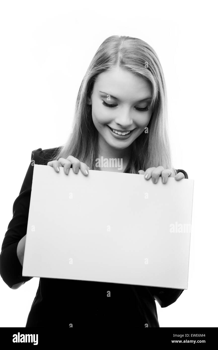 Girl holding blank piece paper Black and White Stock Photos & Images
