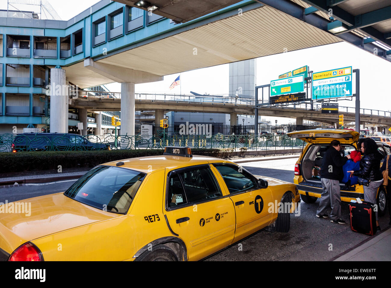 New York City,NY NYC,Queens,LaGuardia Airport,LGA,outside exterior,taxi,cab,picking up passenger,NY150325011 Stock Photo