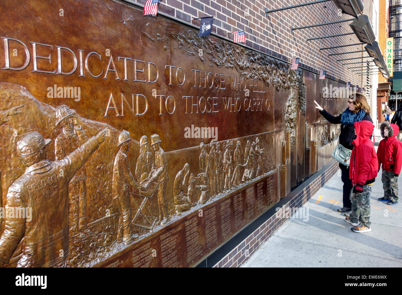 New York City,NY NYC,Manhattan,Lower,Financial District,National September 11 Memorial & Museum,911 9/11,plaza,pools,bronze mural relief plaque,firema Stock Photo