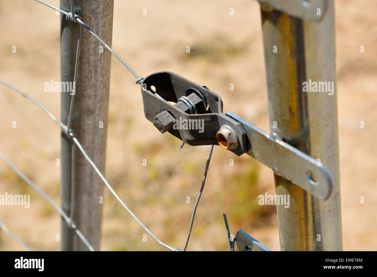 Simple wire tensioner on wire fence Stock Photo