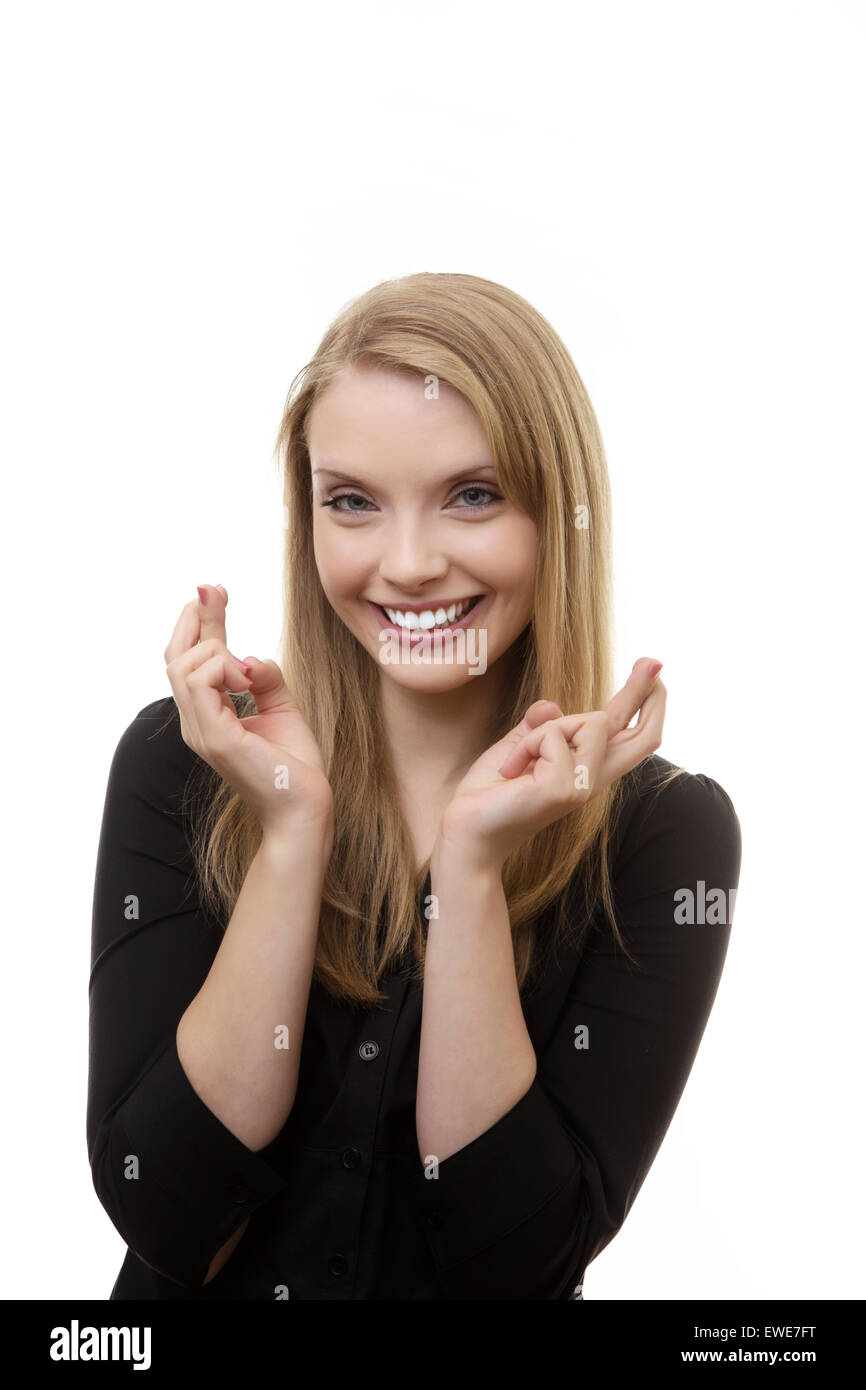 woman with her fingers crossed on both hands Stock Photo Alamy