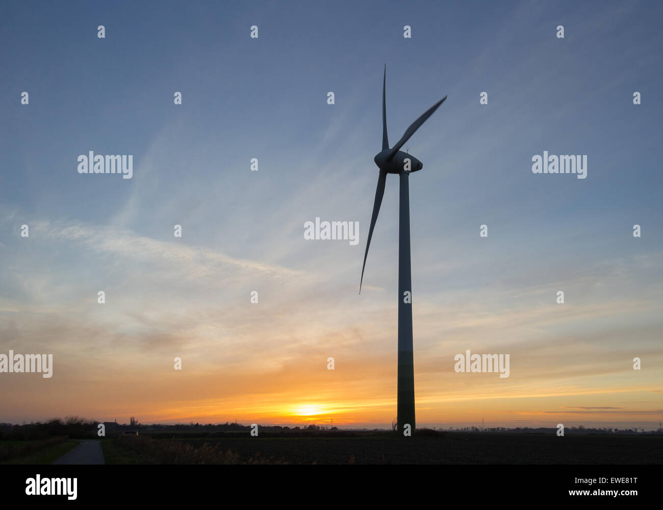 Hinte, Germany, a wind turbine in the sunset Stock Photo