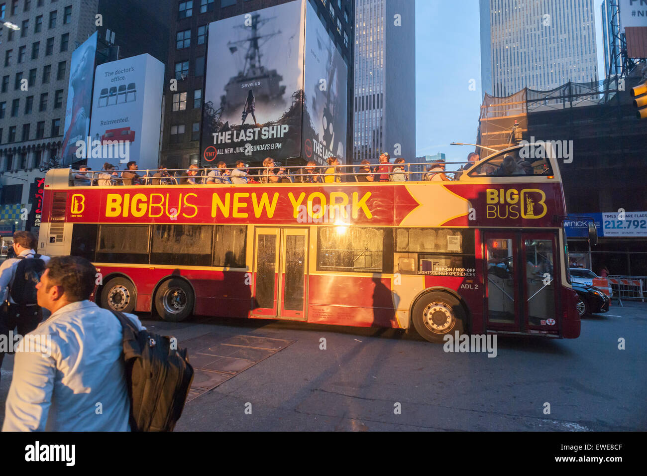 A Big Bus Tour Bus travels through Times Square in New York on Tuesday