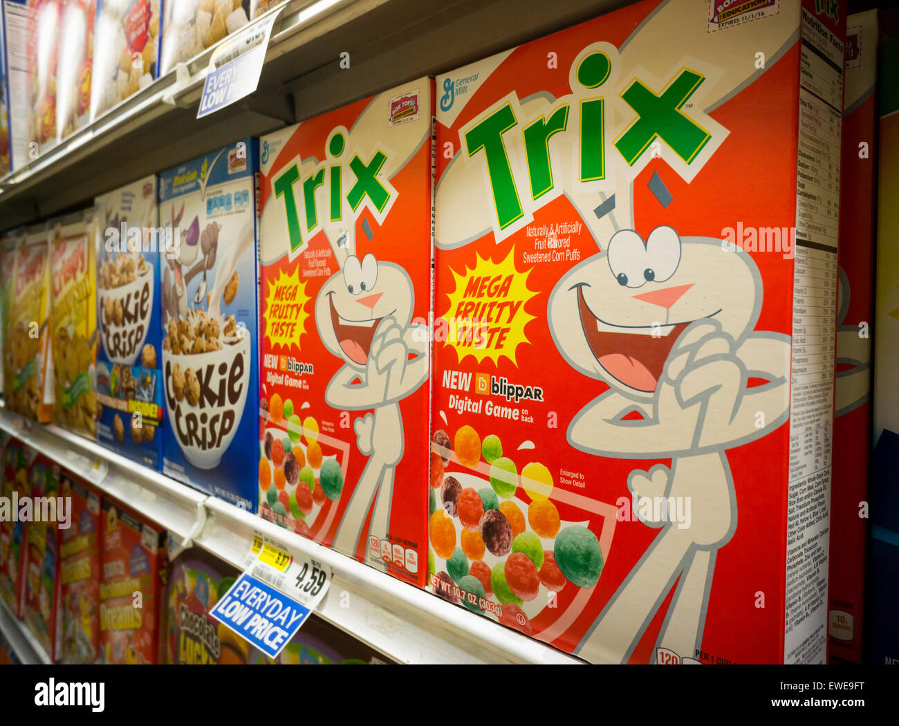 Boxes of General Mills breakfast cereals including Trix displayed on supermarket shelves in New York on Tuesday, June 23, 2015. General Mills announced that it will phase out artificial flavors and colors in its breakfast products by 2017.The company joins a growing list of food manufacturers removing artificial ingredients in a move to satisfy consumers' demands for 'natural'. (© Richard B. Levine) Stock Photo