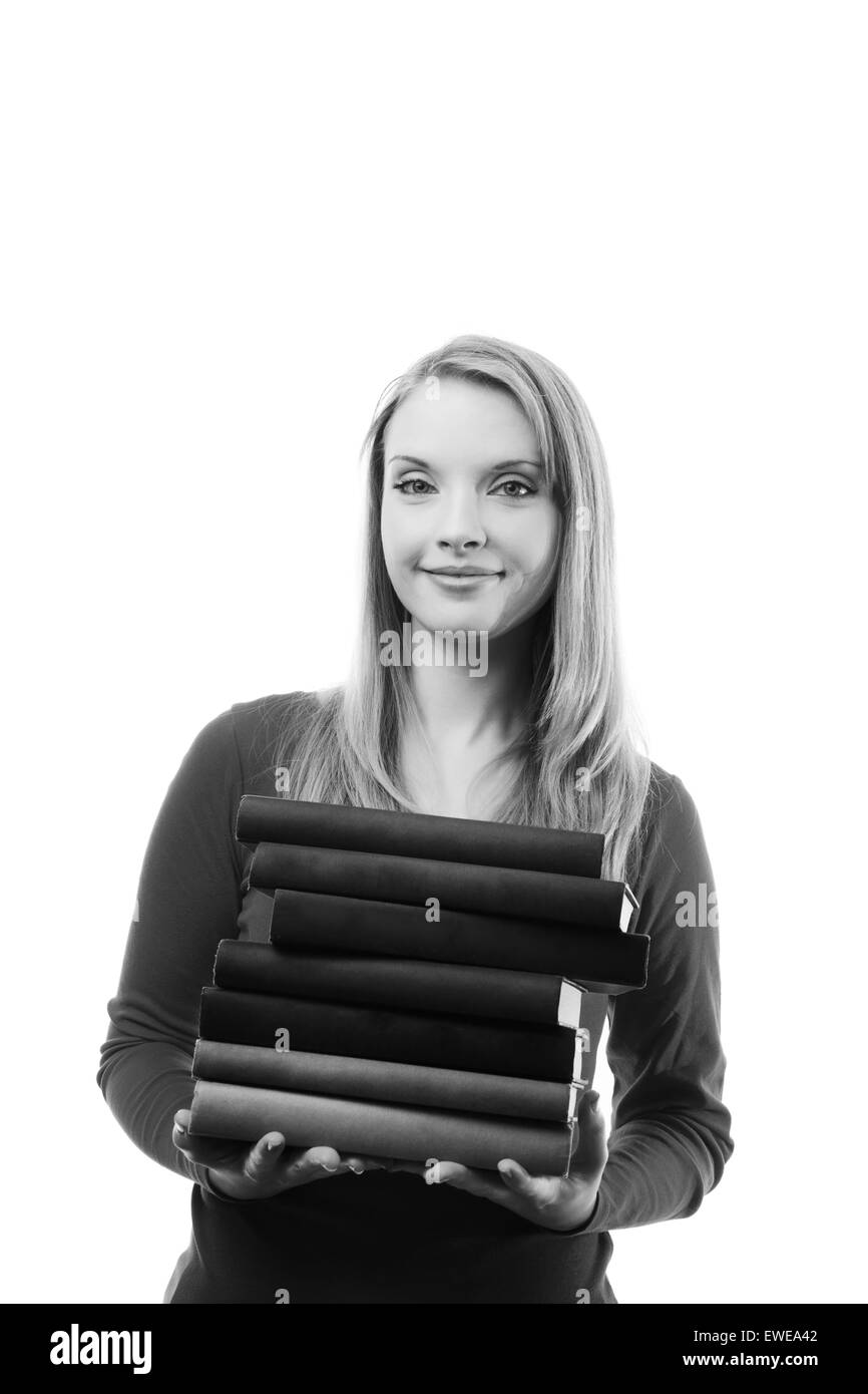 woman holding a stack of hard back books Stock Photo