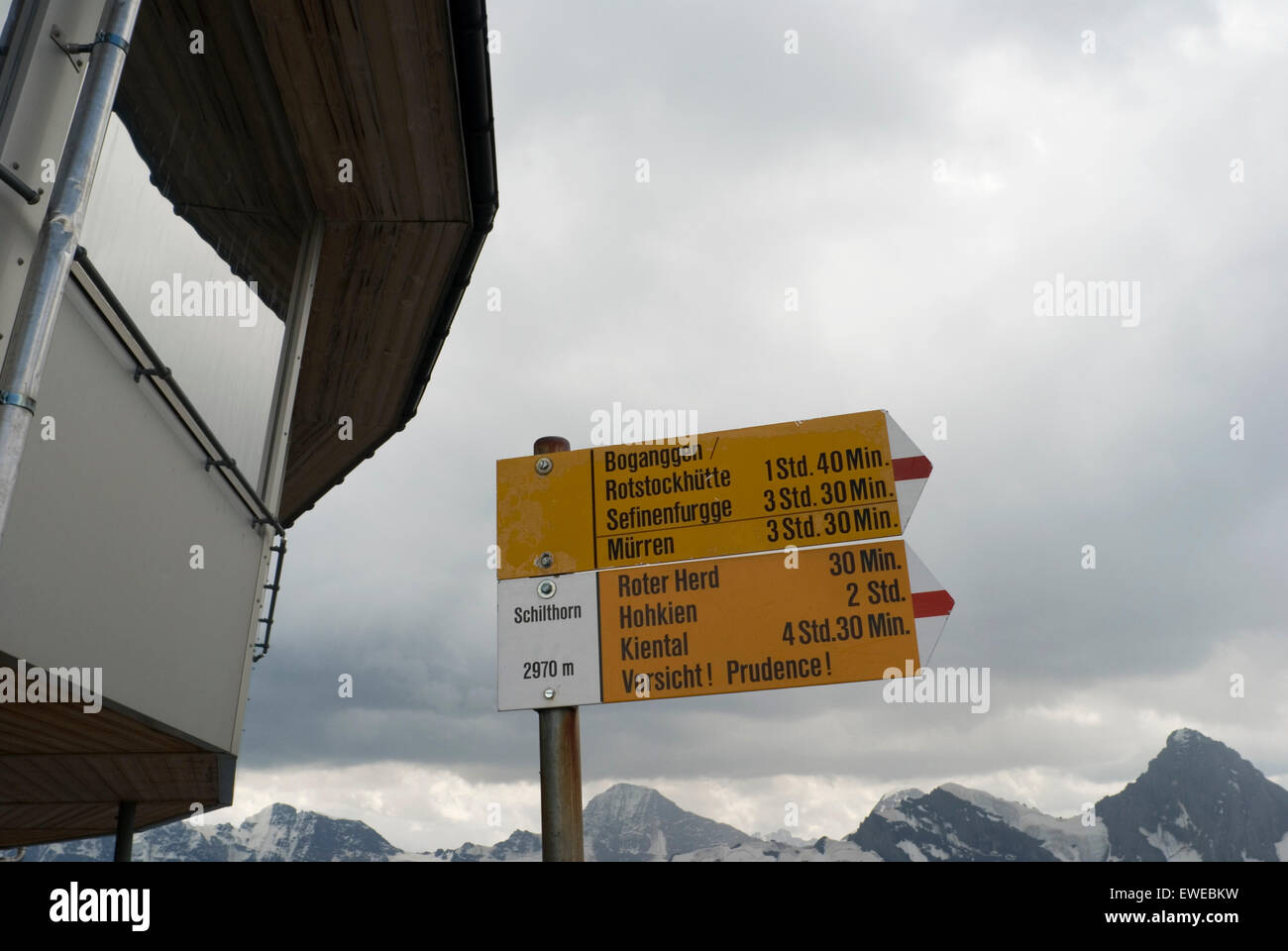 Alpine directional sign on Mt. Schilthorn near Piz Gloria restaurant , Bernese Oberland, Switzerland Stock Photo