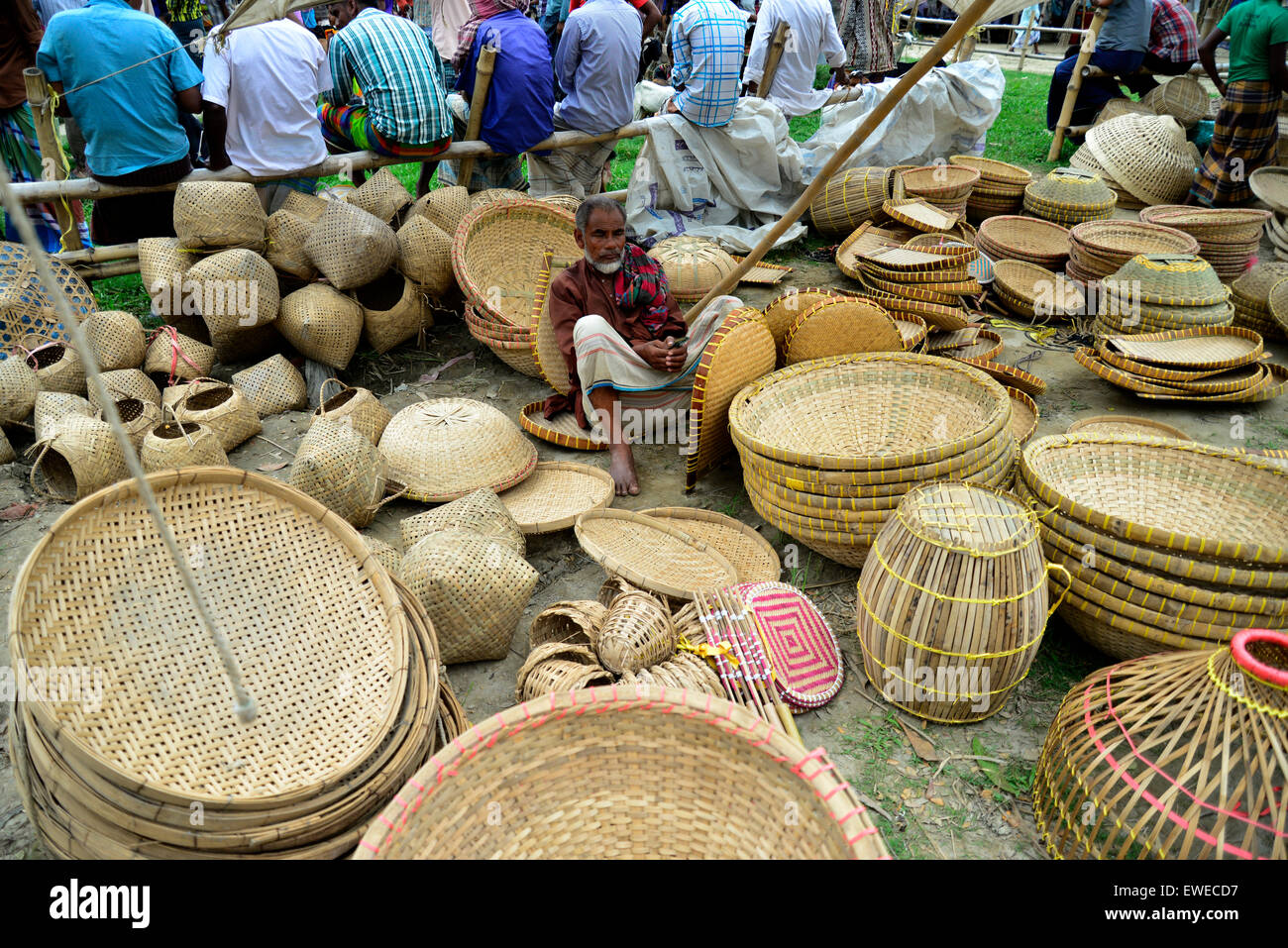 A shopkeeper display the basket made by bamboo for sale at Kaikkarateke market, Narayanganj