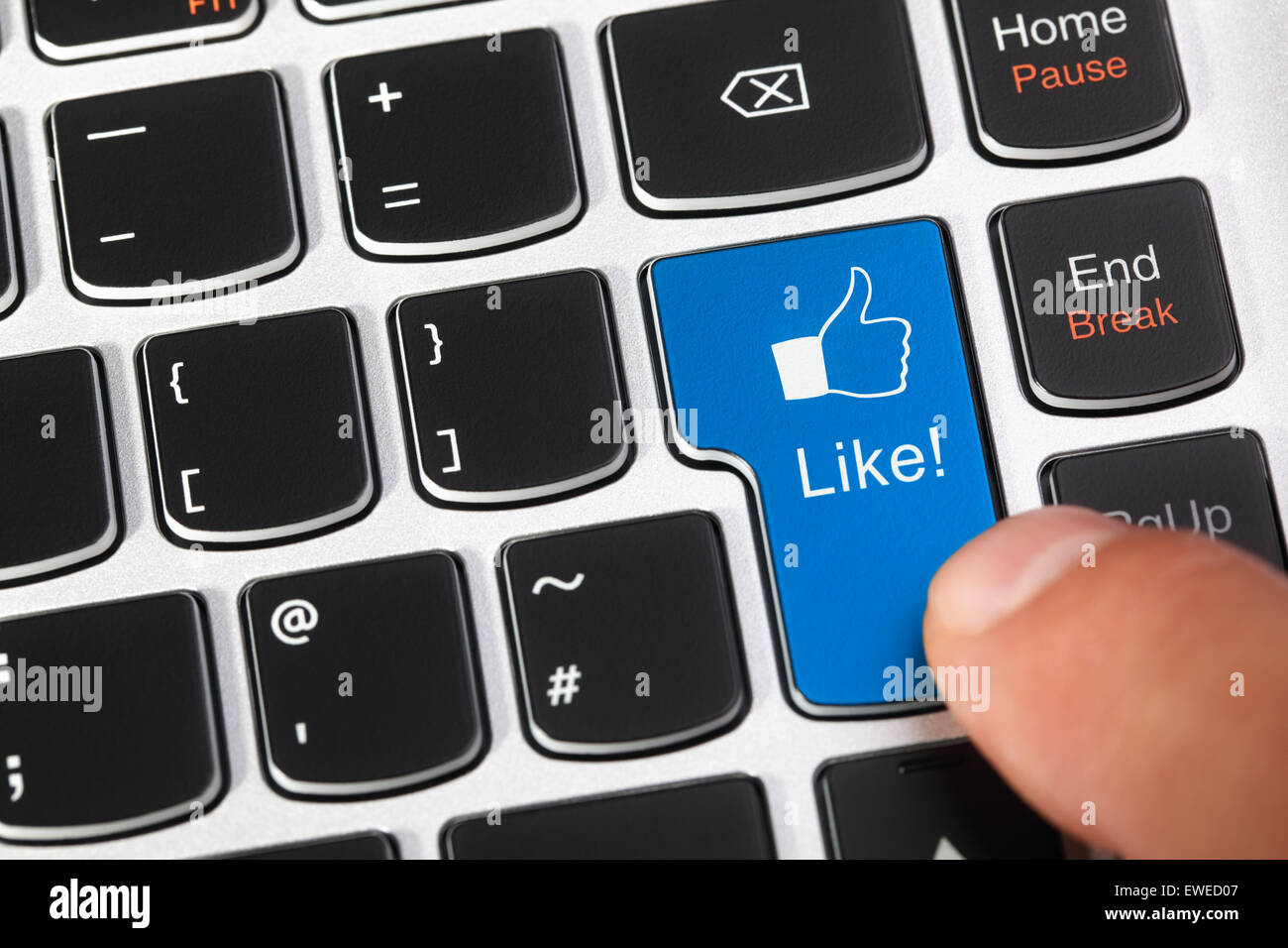 Computer keyboard enter key with like thumbs up icon concept for social media, social networking and approval Stock Photo