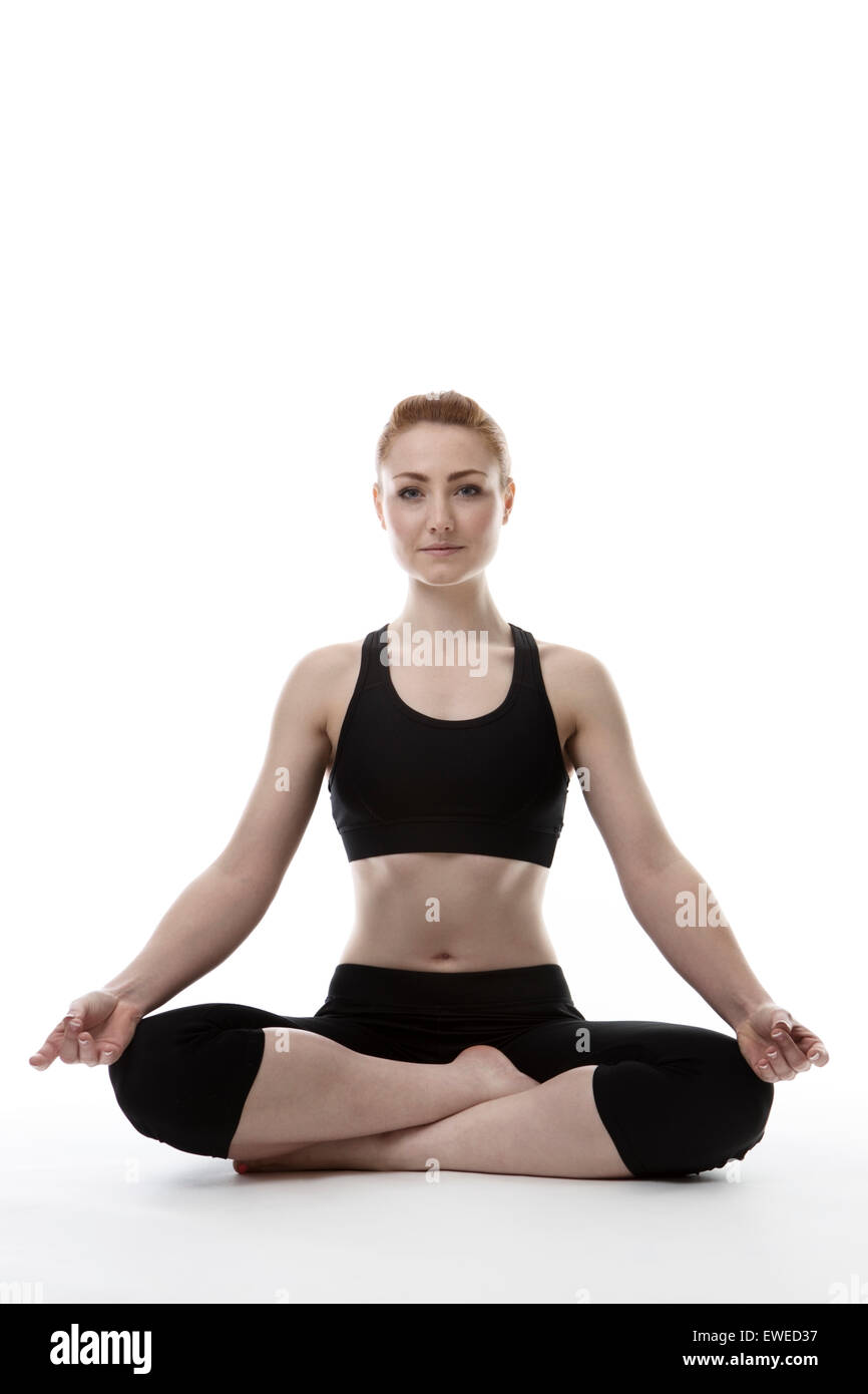 young woman on the floor doing yoga Stock Photo - Alamy