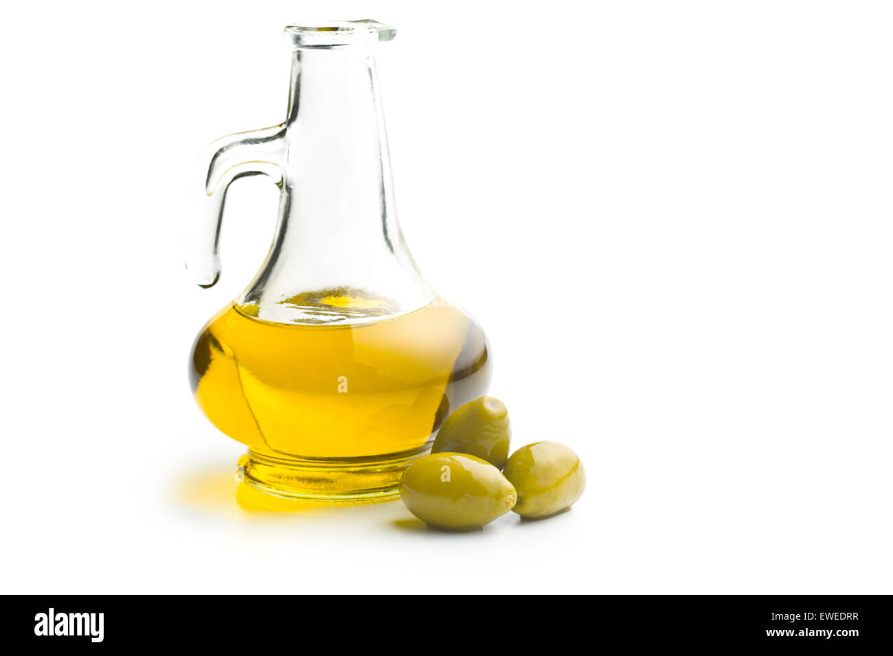 green olives and oil on white background Stock Photo - Alamy