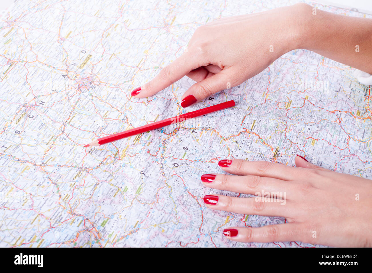 Business trip check list, woman holding red pencil Stock Photo