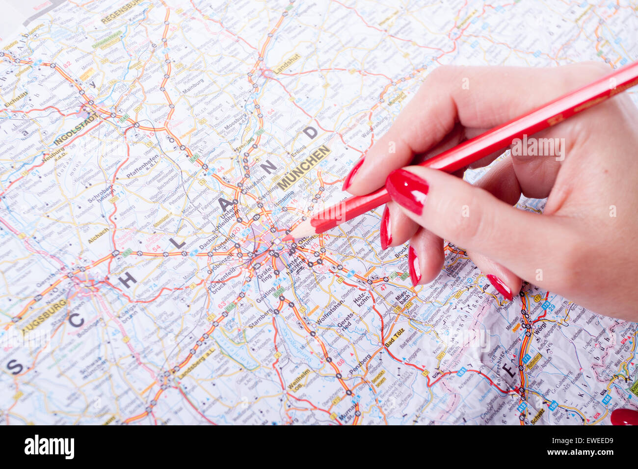 Business trip check list, woman holding red pencil Stock Photo