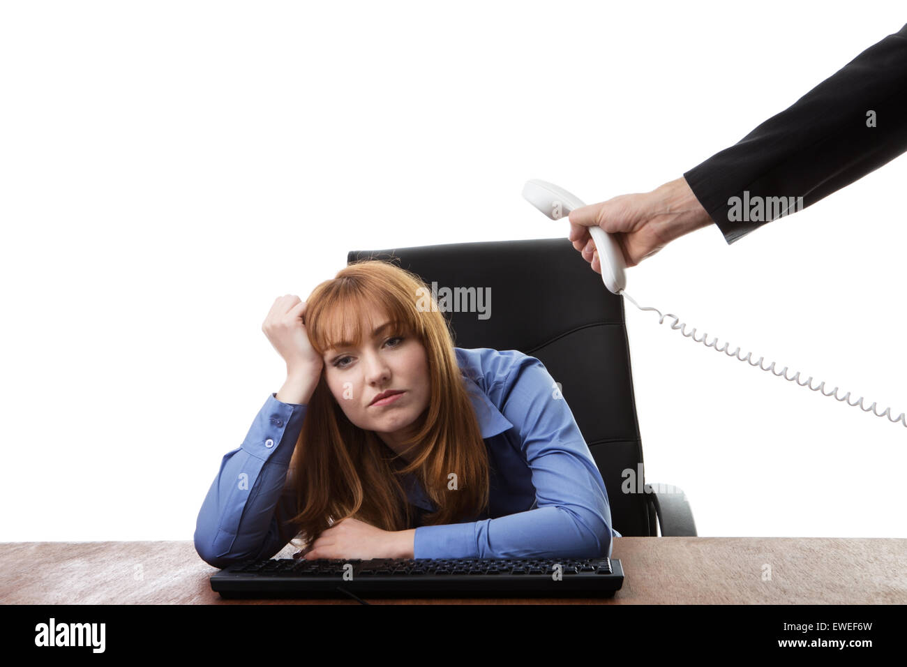 business woman sitting at her desk not looking very happy Stock Photo ...