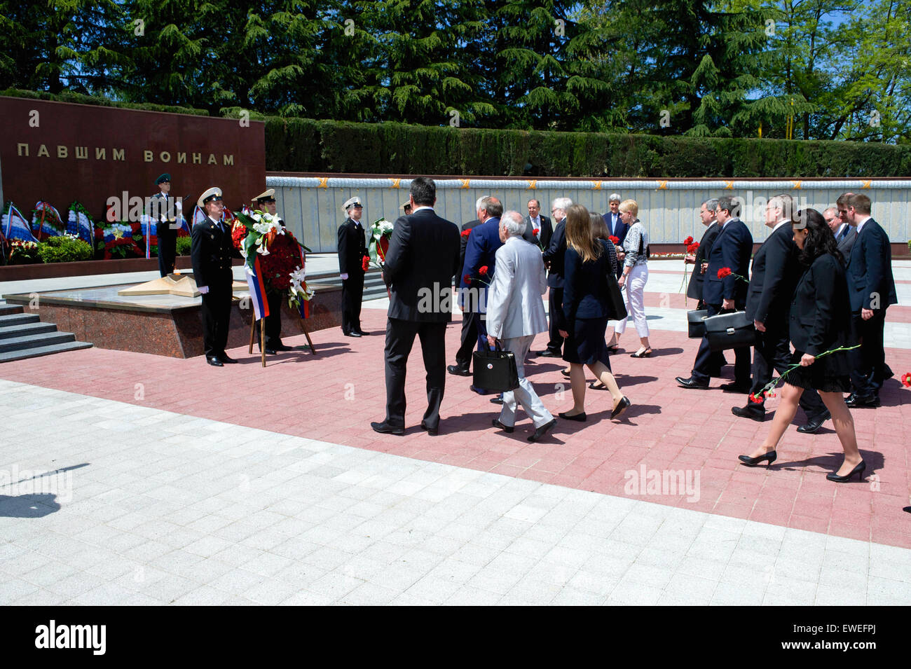 U.S. Secretary of State John Kerry and Russian Foreign Minister Sergey Lavrov watch as members of their respective staffs each place a pair of roses on May 12, 2015, at the Zavokzalny War Memorial in Sochi, Russia, built in 1985 to commemorate the 40th anniversary of the end of World War II, and where about 4,000 soldiers are buried. Stock Photo
